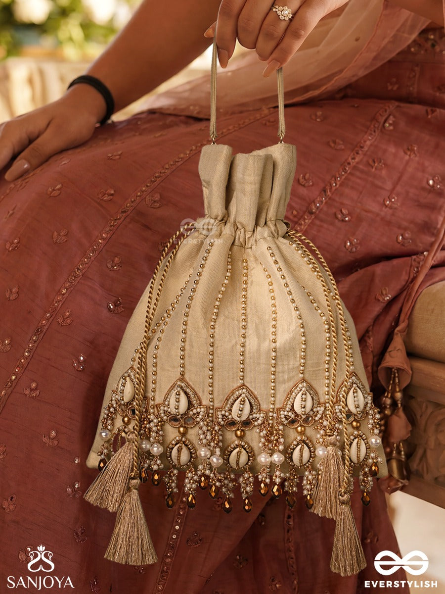 Yasmeenah – Potli Light Champagne Bag With Handplaced Pearl Hangings, Ornamental Thread Accents And Braided Ties