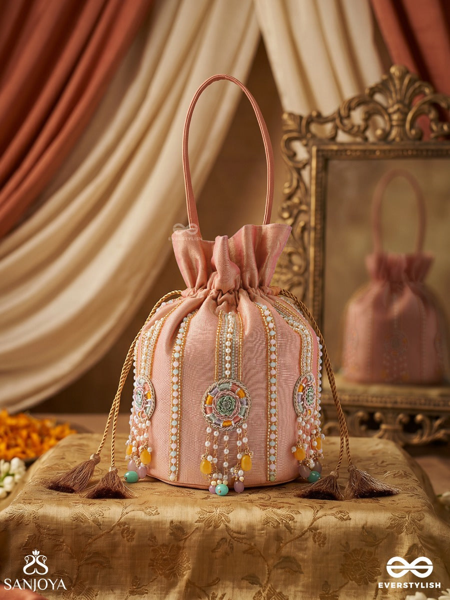 Kainaat – Potli Soft Peach Bag With Multistone Detailing, Jeweled Line Accents And Side Tassels