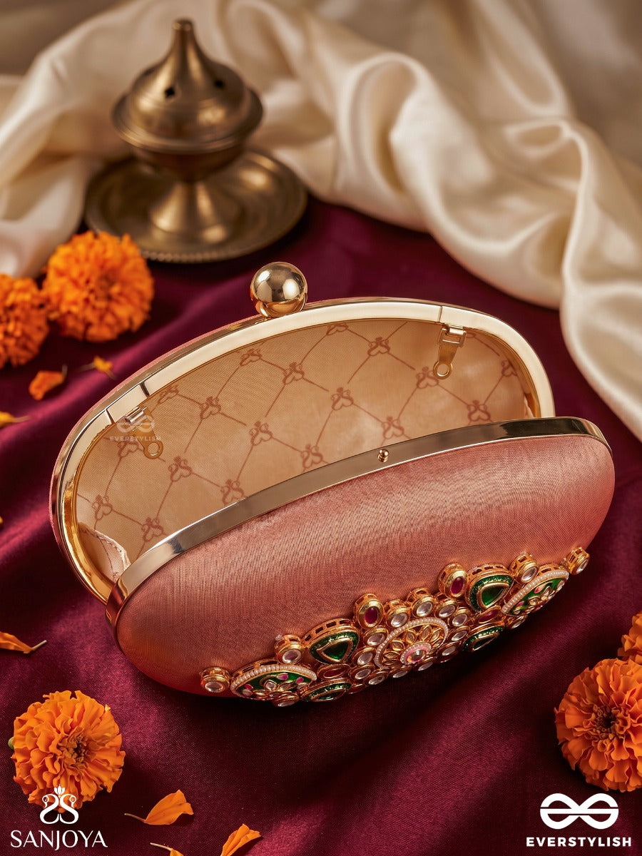 Kainaat – Oval Peach Silk Clutch With Kundan Ornamentation, Floral Enamel Work And Gem Highlights