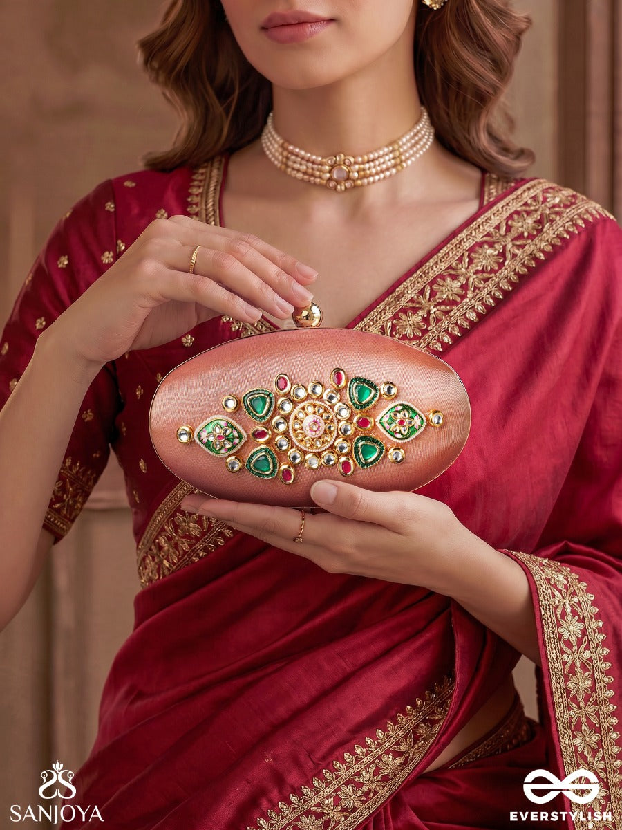 Kainaat – Oval Peach Silk Clutch With Kundan Ornamentation, Floral Enamel Work And Gem Highlights
