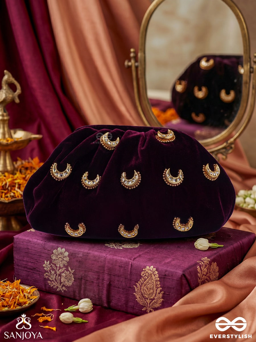Ayshaan – Oval Burgundy Velvet Clutch With Kundan Moon Motifs, Delicate Pearlwork And Draped Silhouette