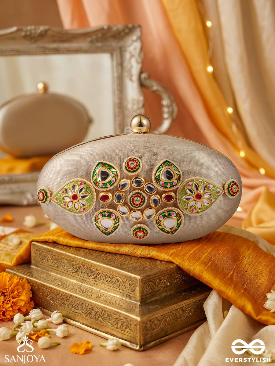 Shahgohar – Oval Ivory Silver Fabric Clutch With Kundan Cluster Design, Meenakari Embellishment And Floral Detailing