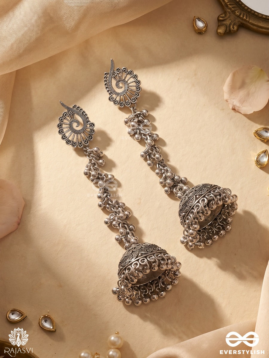 Noopurdhara – Oxidised Jhumka Earrings With Floral Studs, Ghungroo Clusters And Heritage Dome