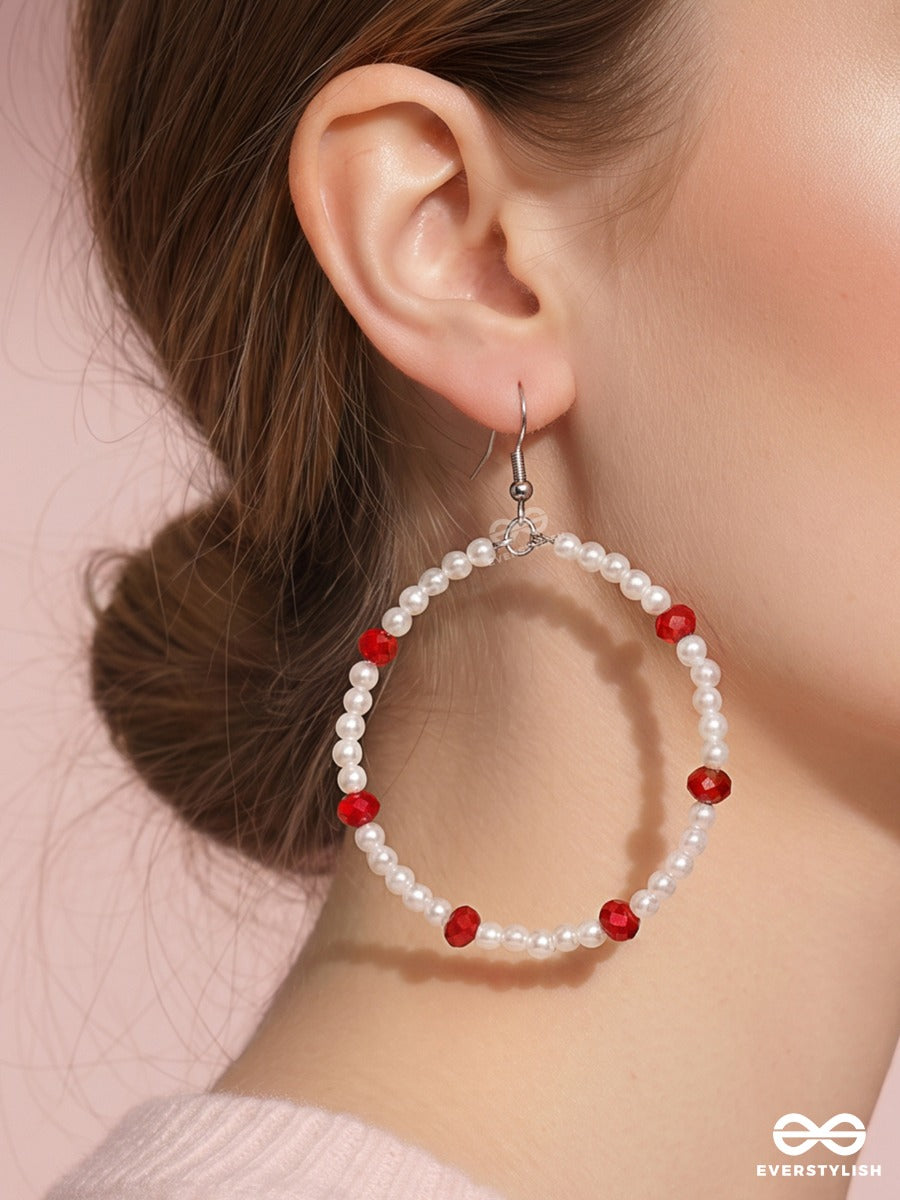 Snow & Ruby – Pearl Oval Hoop Earrings With Crimson Bead Accents
