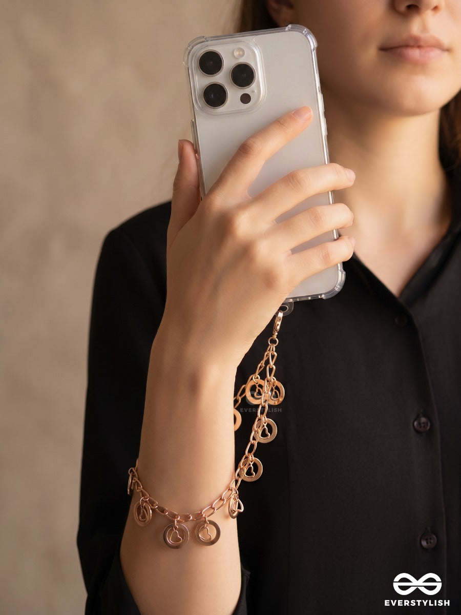 Curl Code – Gold-Tone Phone Sling With Curly Charms