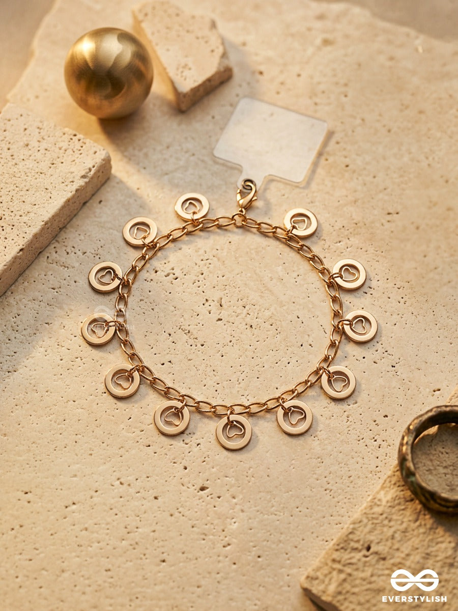 Curl Code – Gold-Tone Phone Sling With Curly Charms