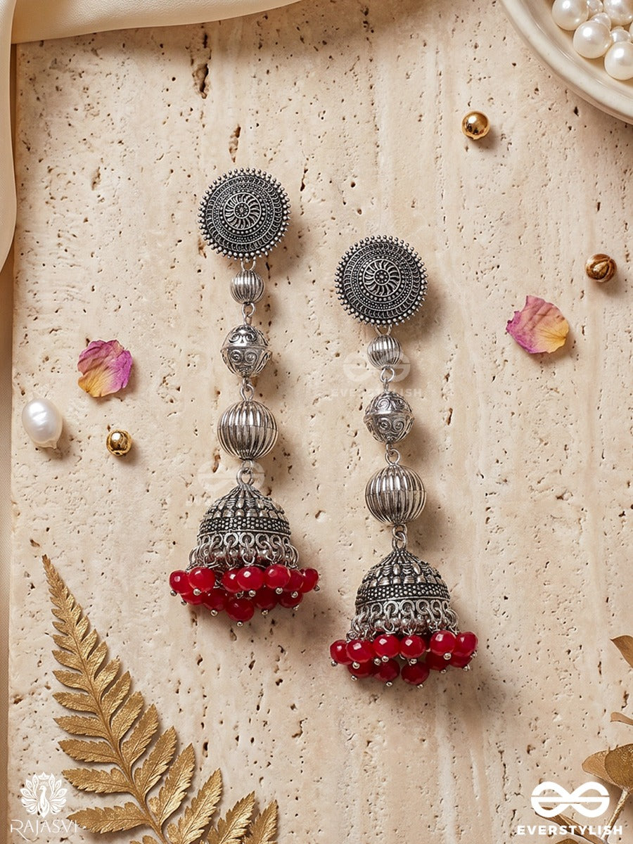 Suryakala – Oxidised Tiered Jhumka Earrings With Radiant Disc Motifs And Ruby Bead Fringe