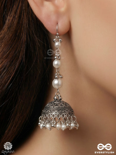 Chandrima – Oxidised Jhumkas With Lustrous Pearl Strands And Carved Dome