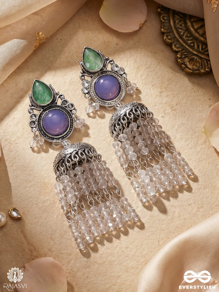 Indraneelika – Oxidised Tassel Earrings With Green Teardrop Stones, Indigo Accents And Pearl Cascades