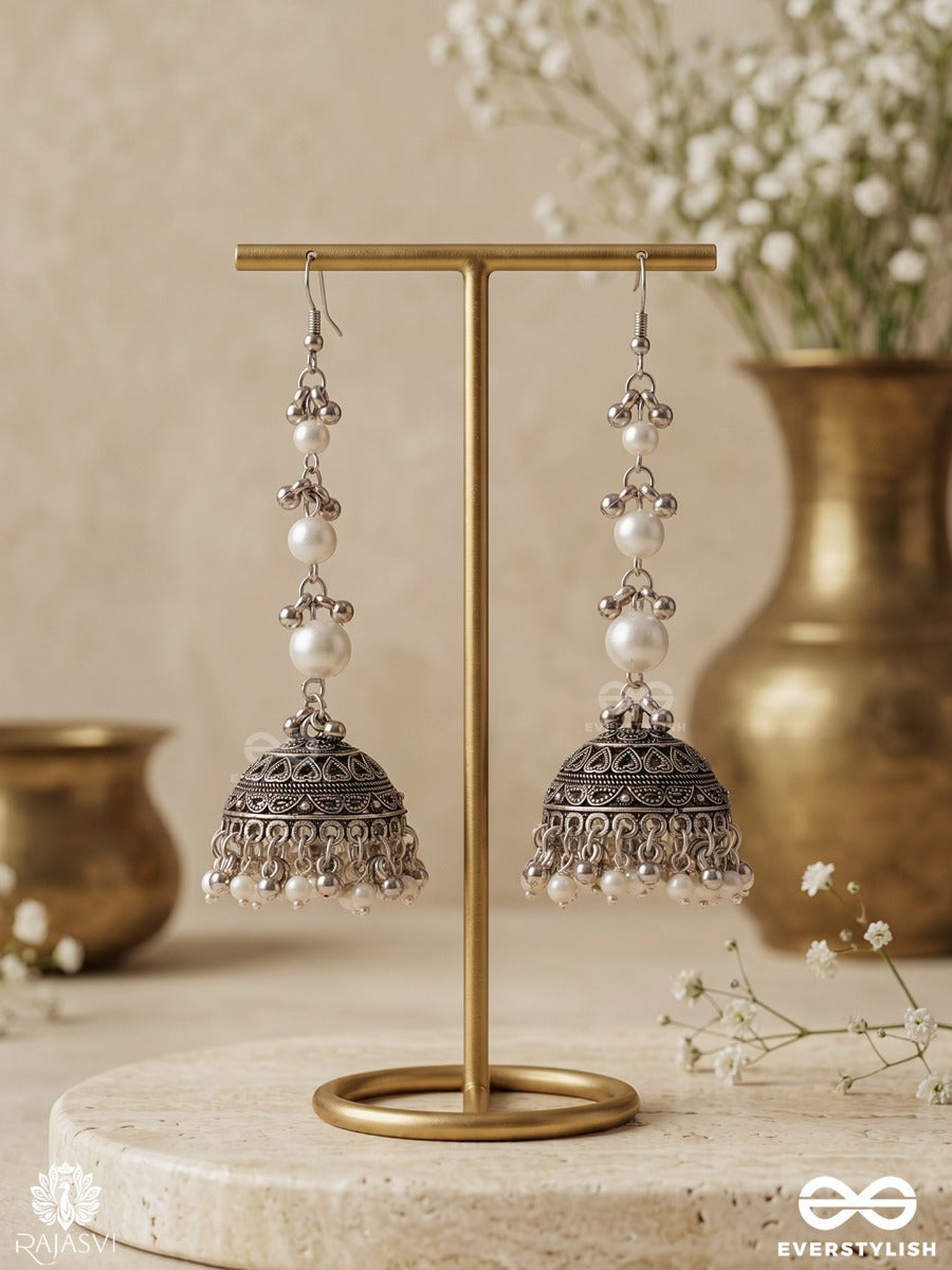 Chandrima – Oxidised Jhumkas With Lustrous Pearl Strands And Carved Dome