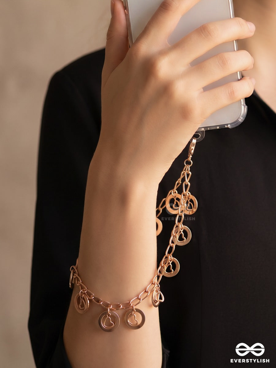 Curl Code – Gold-Tone Phone Sling With Curly Charms