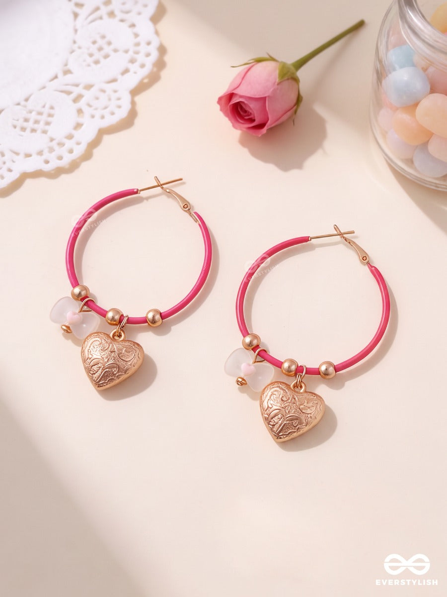 Heart Hush – Pink Hoop Earrings With Embossed Heart Charms