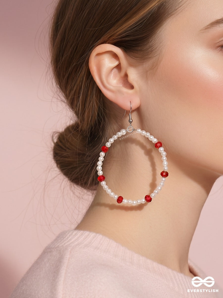 Snow & Ruby – Pearl Oval Hoop Earrings With Crimson Bead Accents
