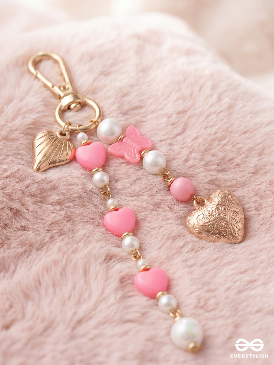 Heart Wings – Winged Heart Bag Charm With Pink And White Bead Details