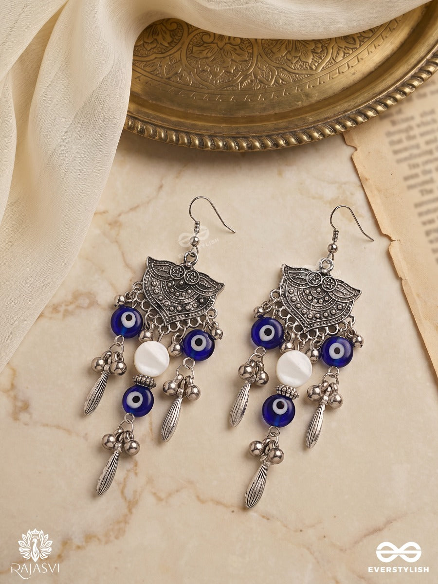 Drishtika – Oxidised Earrings With Blue Evil Eye Beads, Ghungroo Drops And White Accents
