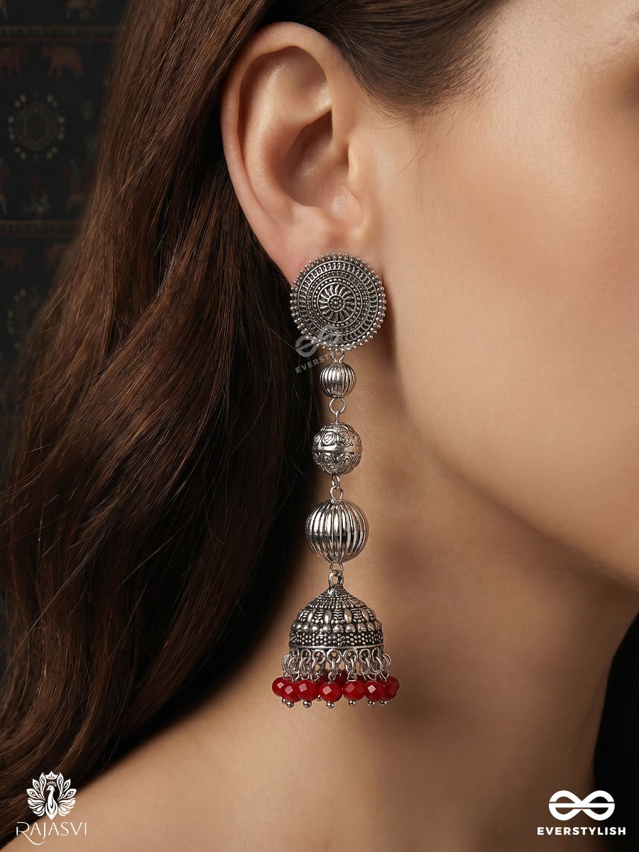 Suryakala – Oxidised Tiered Jhumka Earrings With Radiant Disc Motifs And Ruby Bead Fringe