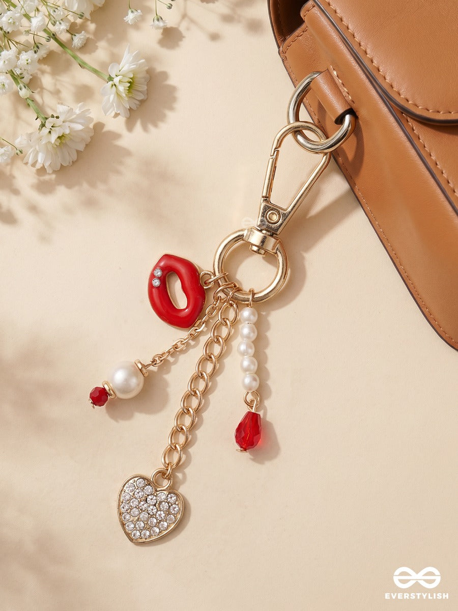 Kiss & Tell – Lip Bag Charm With Crystal Heart Details