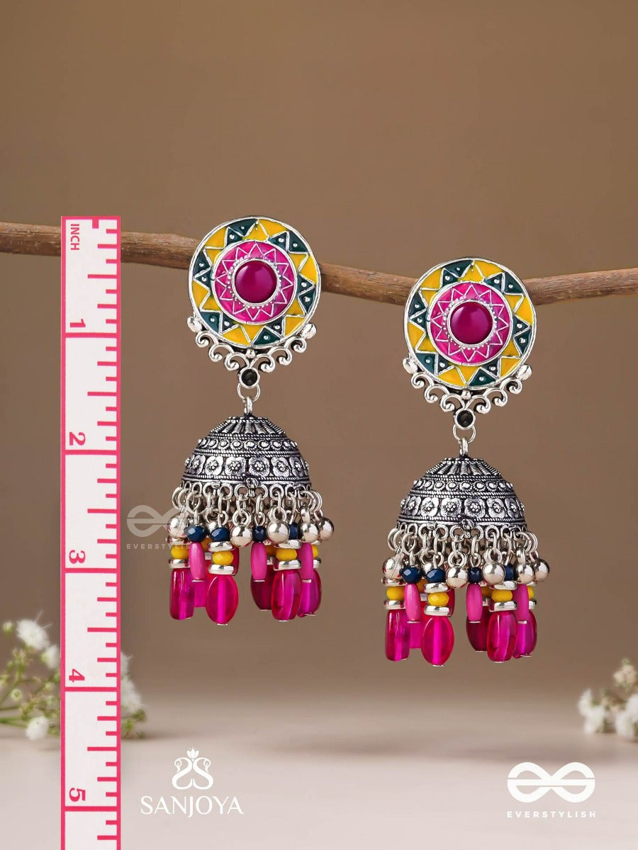 Suryaruchi-Sun's Radiance-Lavish Pink Earrings Enamelled With A Sun Motif And Oxidized Jhumka Adorned With Beads And Ghunghroos