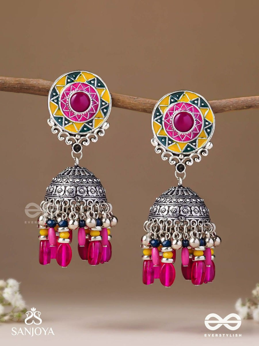 Suryaruchi-Sun's Radiance-Lavish Pink Earrings Enamelled With A Sun Motif And Oxidized Jhumka Adorned With Beads And Ghunghroos