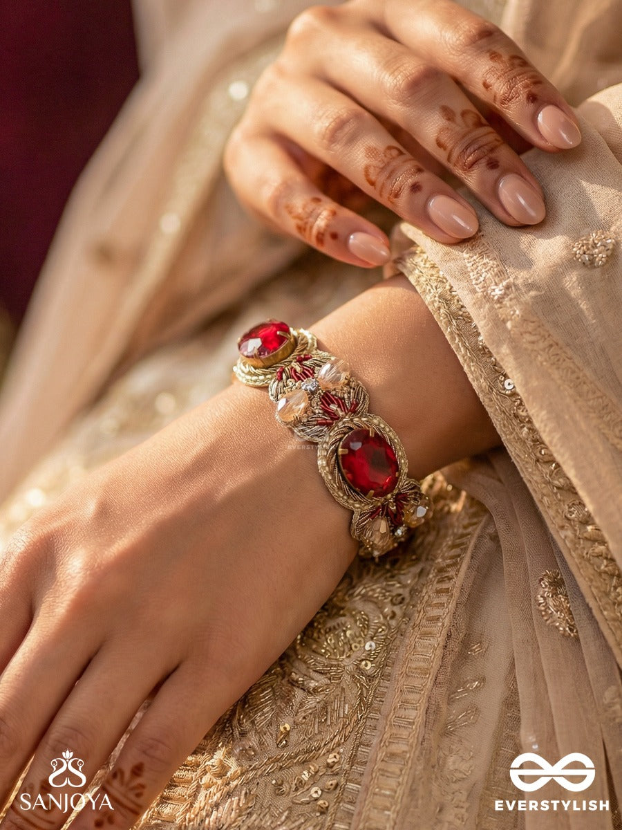 Sundarasura- Beautiful Wine- Bracelet With Rich Hue Of The Red Stones And Twisted Thread Work.