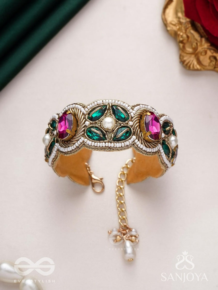 Tarangini-Wavy Beauty-Opulent Bracelet Embedded With Purple And Green Stones