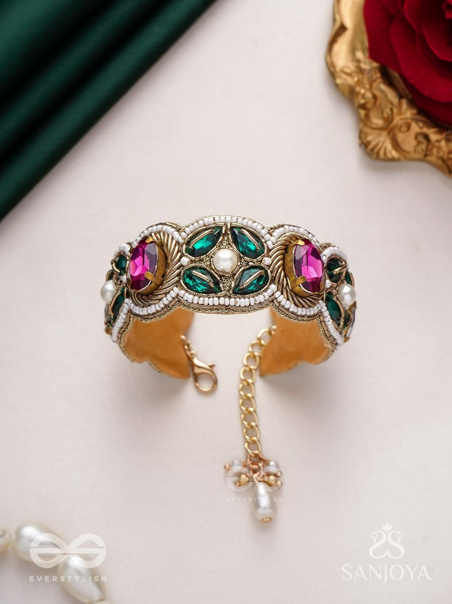 Tarangini-Wavy Beauty-Opulent Bracelet Embedded With Purple And Green Stones