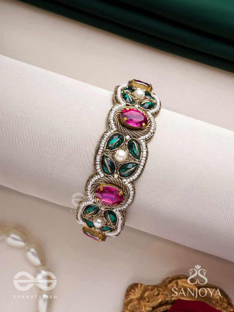 Tarangini-Wavy Beauty-Opulent Bracelet Embedded With Purple And Green Stones