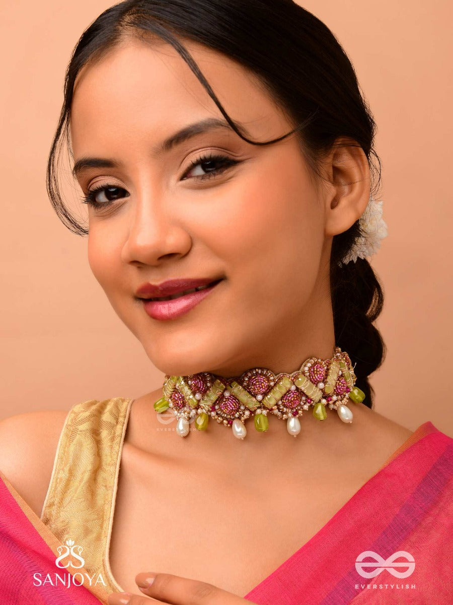 Manimekhala-Bejewelled Girdle-Choker Adorned With Pink And Gold Gemstones, Beads And Delicate Pearl Drops.
