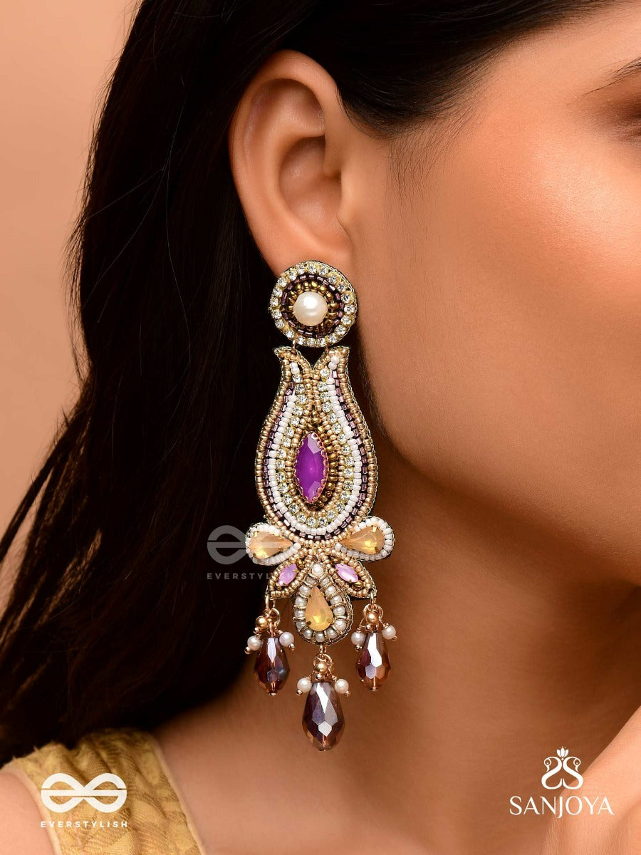 Divyashobhana-Divine Splendour-Lotus-Inspired Embroidered Design, Adorned With Purple And Golden Gem-Studded Motifs, Pearl And Beads.