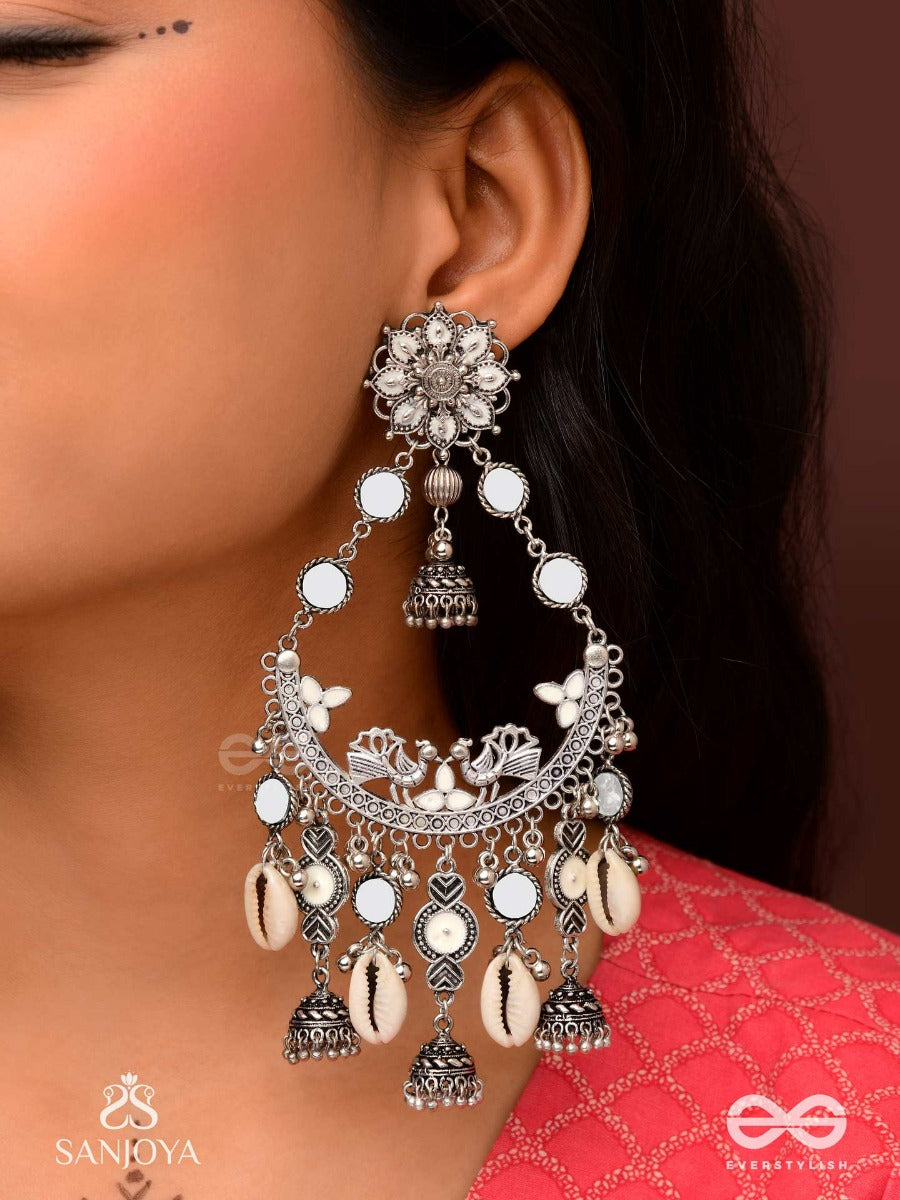 Chandramayura- Moon-Peacock Earrings- Oxidized Chaandbaali Earrings, Adorned With Mirrors, Ghunghroos, Cowrie Shells, And Dangling Jhumka