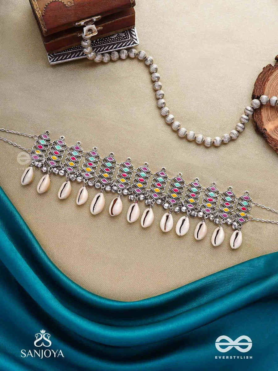 Shankhamala-Conch Garland- Oxidized Neckpiece Featuring Pastel-Coloured Metalwork, Embellished With Dangling Cowrie Shells And Ghungroo's