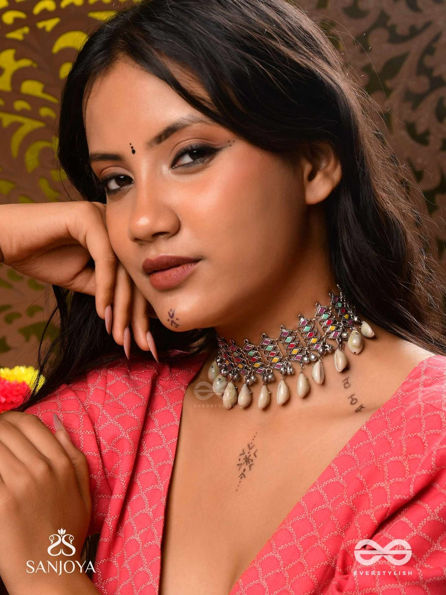 Shankhamala-Conch Garland- Oxidized Neckpiece Featuring Pastel-Coloured Metalwork, Embellished With Dangling Cowrie Shells And Ghungroo's
