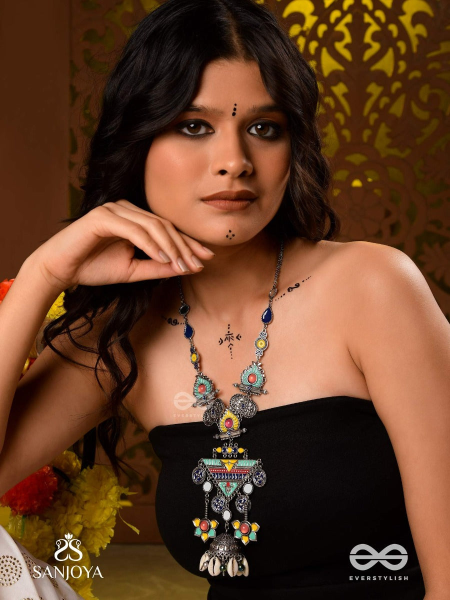 Rangapadma-Color Bloom- Enamelled Neckpiece With Cowrie Shells,Mirror And Colorful Gemstones On Oxidized Metalwork.