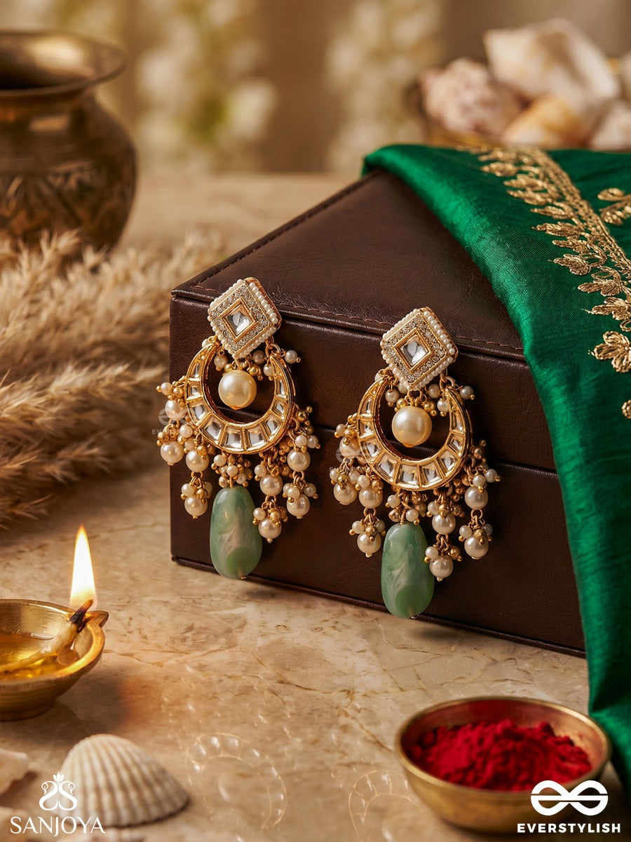 Purnima Phool - Full Moon Flower An Exquisite Kundan Earring Featuring Golden Designs, Pearl Clusters, And A Green Gemstone Drop, Symbolizing Elegance