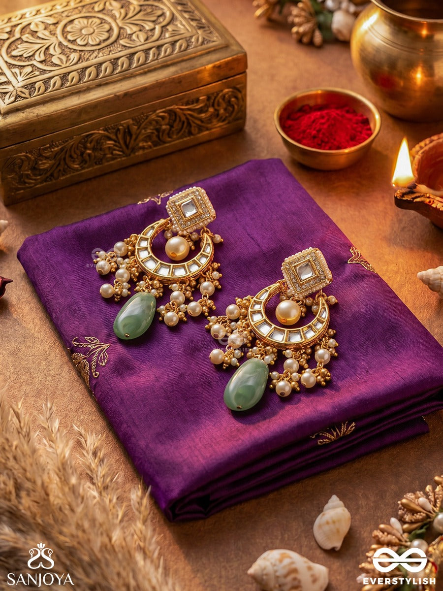 Purnima Phool - Full Moon Flower An Exquisite Kundan Earring Featuring Golden Designs, Pearl Clusters, And A Green Gemstone Drop, Symbolizing Elegance