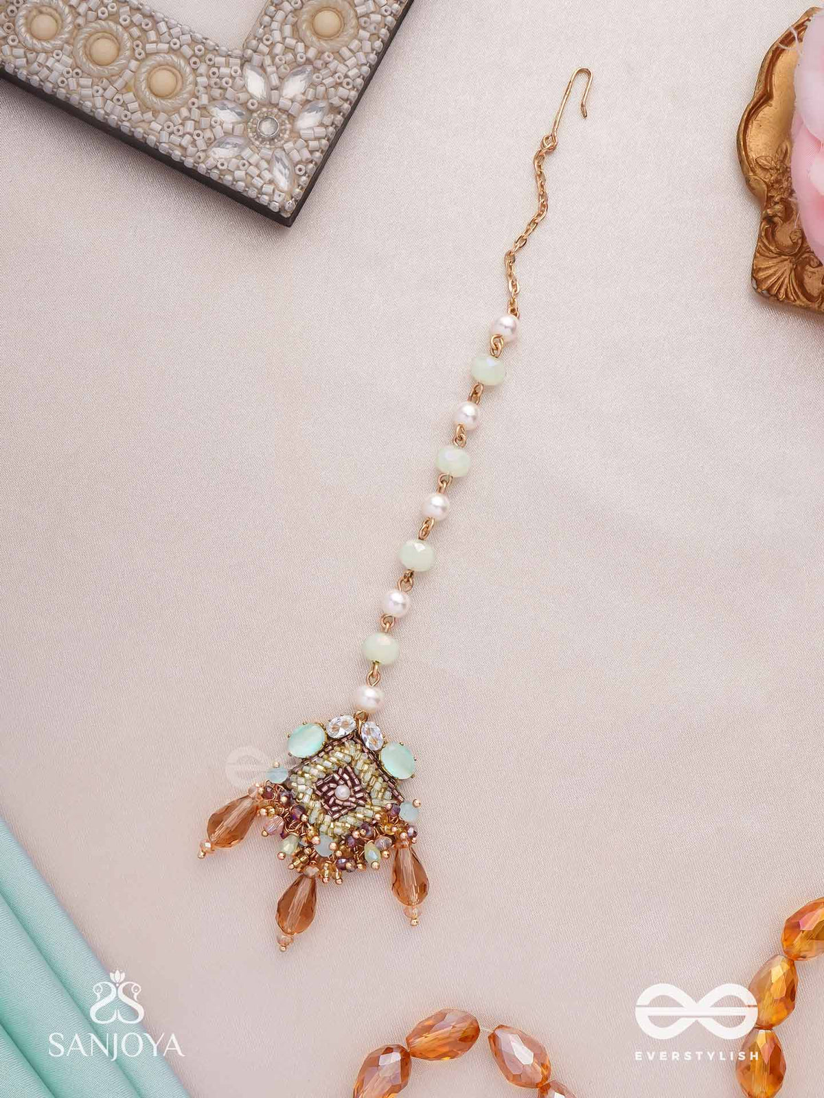 Sundara Shobha - Beautiful Radiance- Elegant Mangtika Surrounded By Sparkling Stones, Delicate Pearls And Light Green Beads