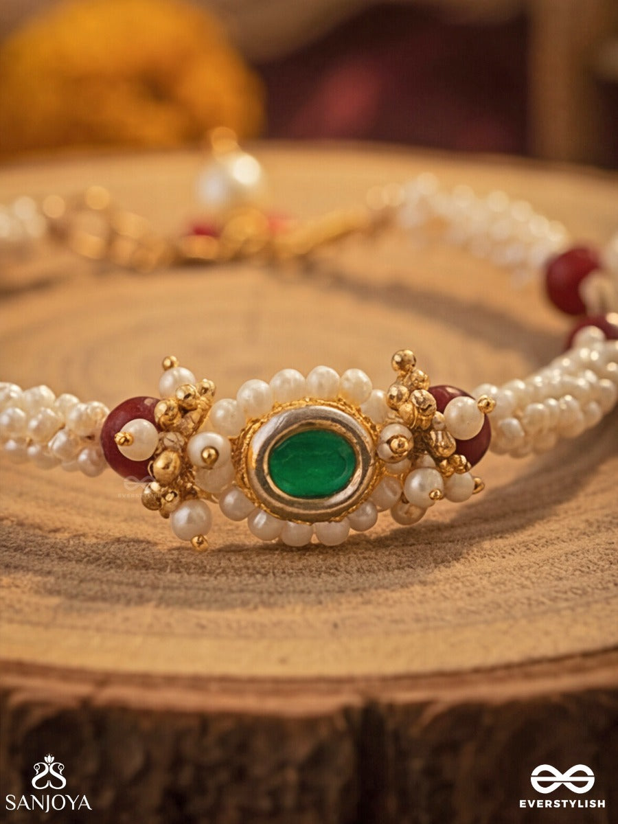 Saanvika - Softly Radiant - Delicate Pearl Bracelet Pair With Maroon Bead Accents And An Emerald-Tone Centre Detail