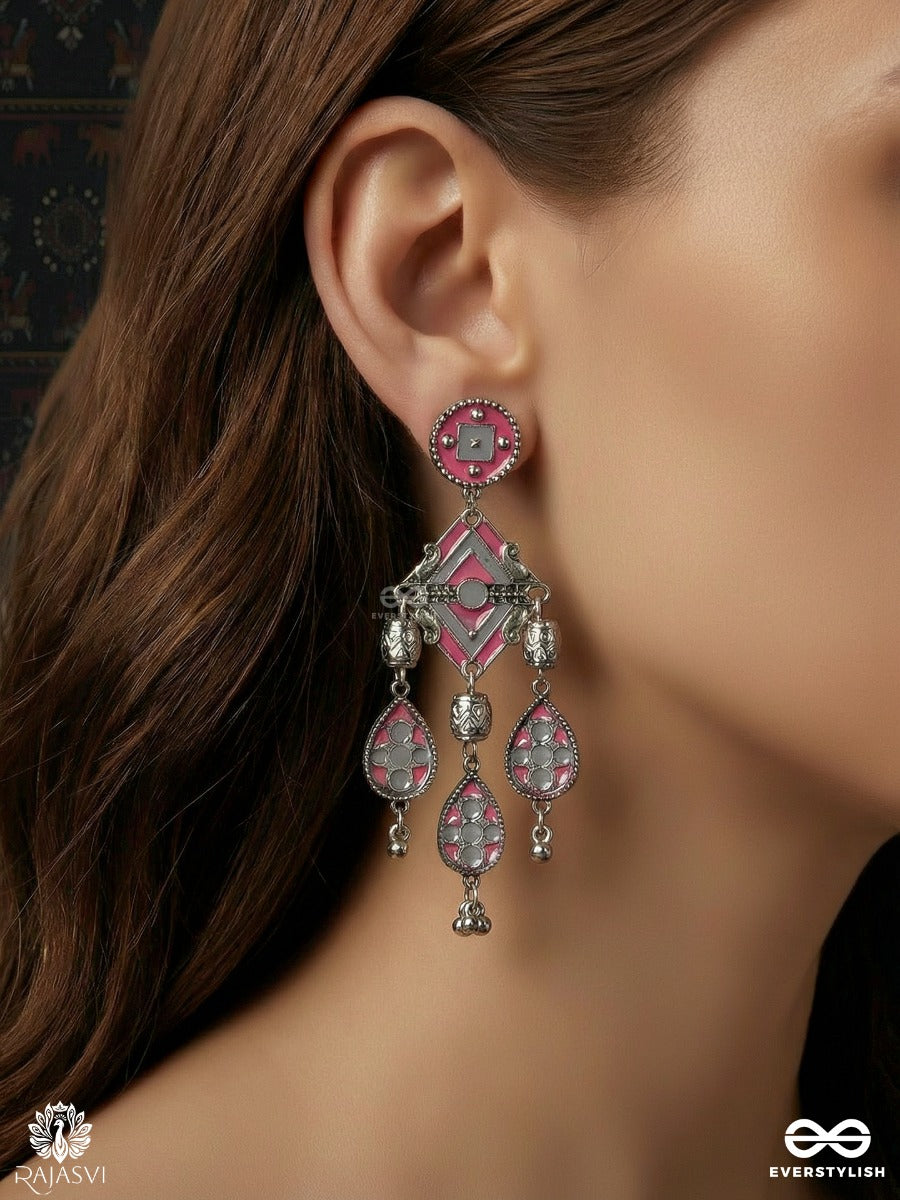 Chandrang - Oxidised Earrings With Ornate Panels And Red Dangling Charms