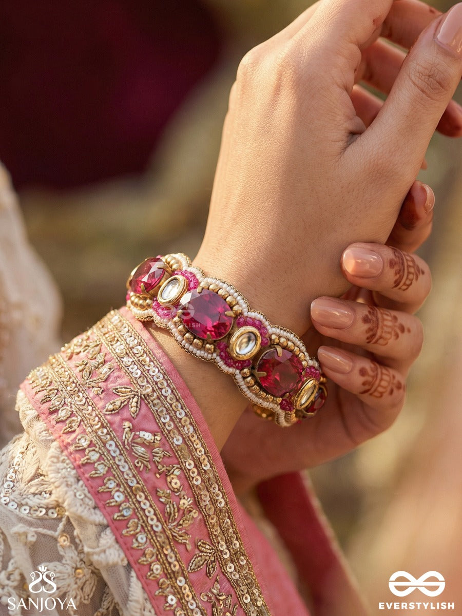 Rangkirti - Glory Of Colours - Statement Bracelet With Faceted Ruby-Toned Stones And Pearl Embellished Frame