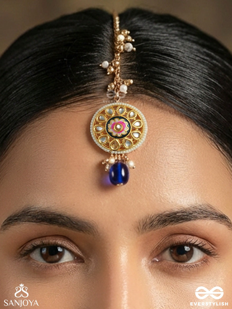 Alokpratika - Radiant Emblem - Delicate Maangtika With Enamelled Disc, Gem Accents And Single Blue Drop