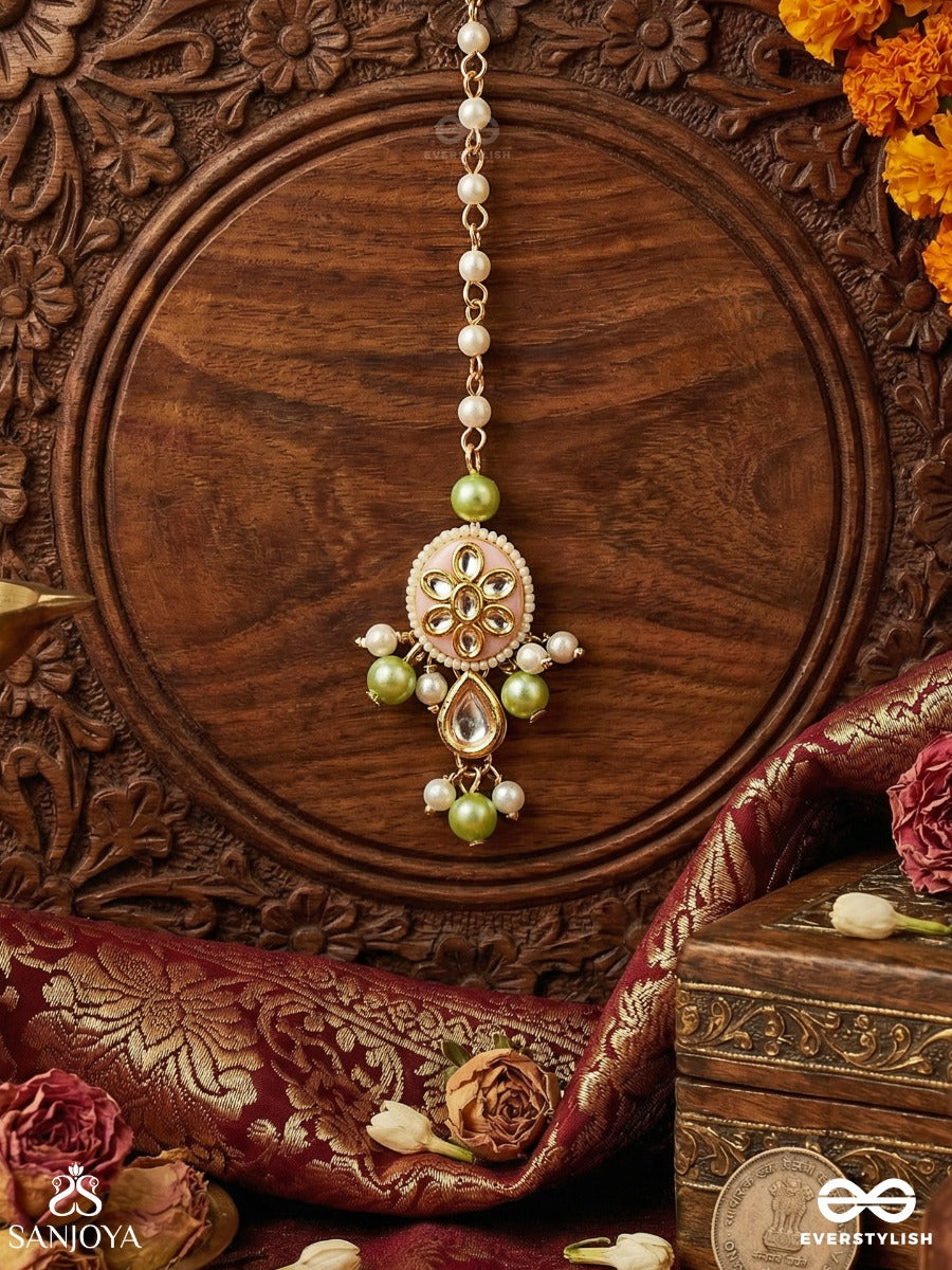 Vasukamini - Treasured Beauty - Elegant Maangtika With Gemmed Bloom And Green Bead Details