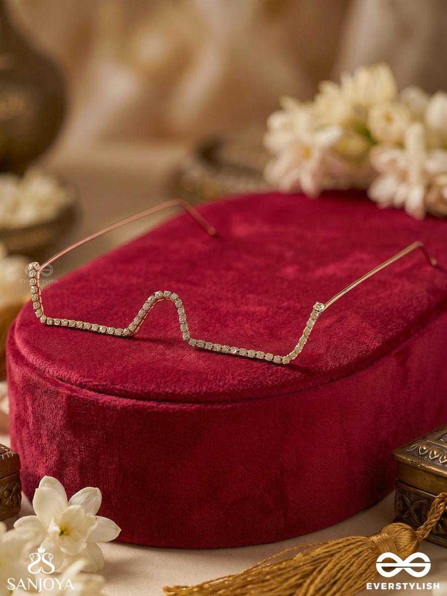 Tarakshi – Starlit Shine – Minimal Rhinestone Face Let With A Sleek Sculpted Wave Design