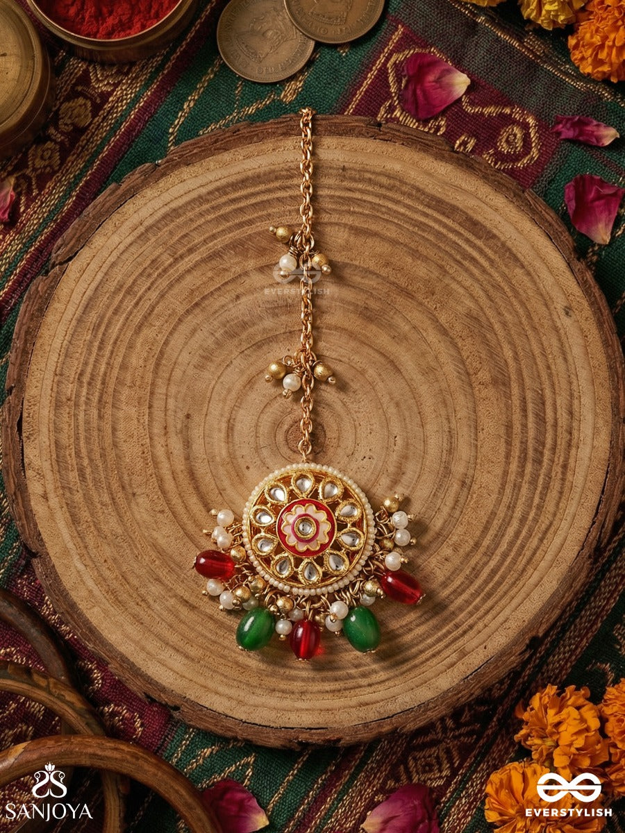 Kanakchitrini - Golden Artistry - Delicate Maangtika With Ornamental Disc, Gem Details And Dangling Accents