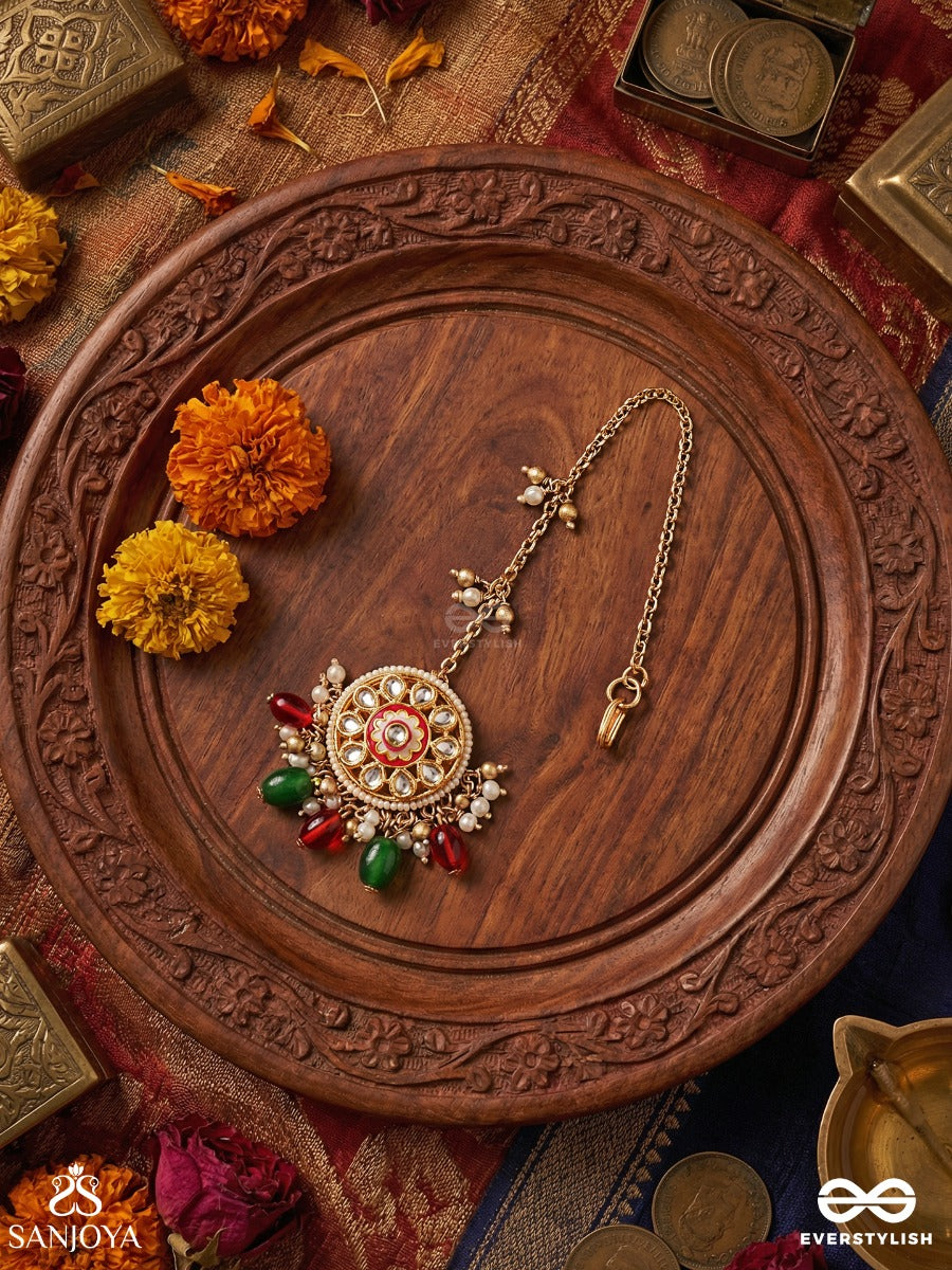 Kanakchitrini - Golden Artistry - Delicate Maangtika With Ornamental Disc, Gem Details And Dangling Accents