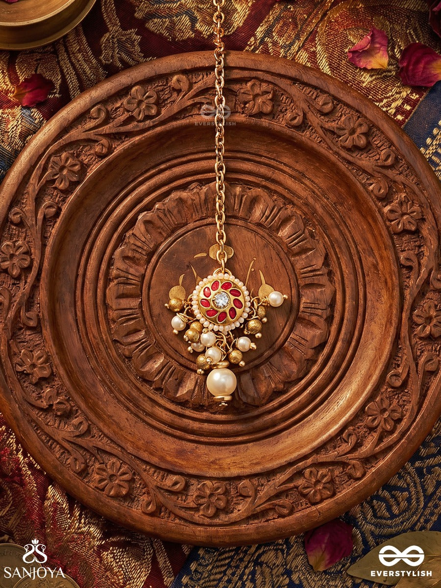 Vasupratika - Treasure Emblem - Delicate Maangtika With Enamelled Medallion, Gem Detailing And Pearl Drop Accent