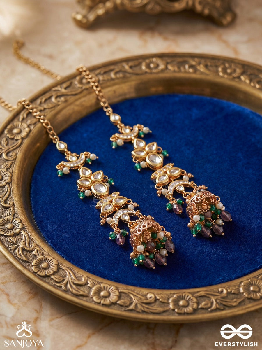 Ojasvini – Radiant Splendour – Straight Kaan Chain Earrings With Leaf-Like Stone Motifs, Deep Blue Accents, Pearl Details And Ornate Hanging Jhumka Ends