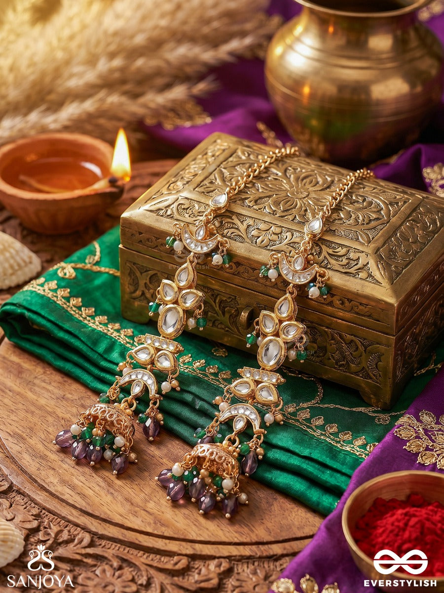 Ojasvini – Radiant Splendour – Straight Kaan Chain Earrings With Leaf-Like Stone Motifs, Deep Blue Accents, Pearl Details And Ornate Hanging Jhumka Ends