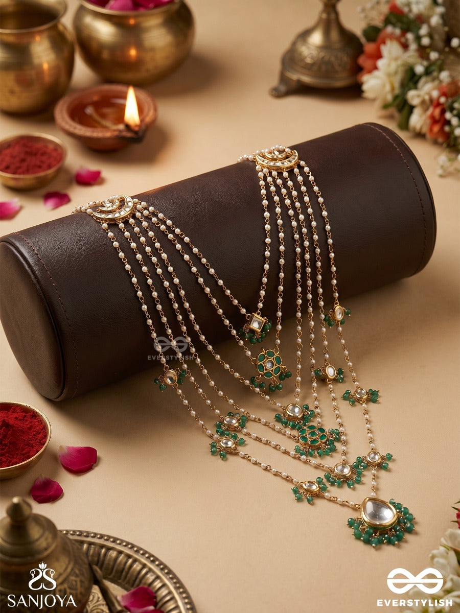 Rajveeni – Royal Melody – Ornate Rani Haar With Multi-Row Pearl Detailing, Green Embellished Motifs And Delicate Chain Falls