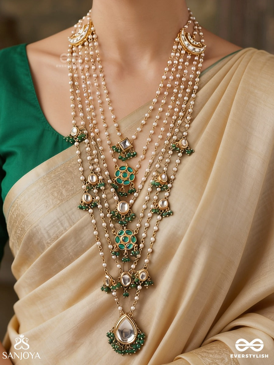 Rajveeni – Royal Melody – Ornate Rani Haar With Multi-Row Pearl Detailing, Green Embellished Motifs And Delicate Chain Falls