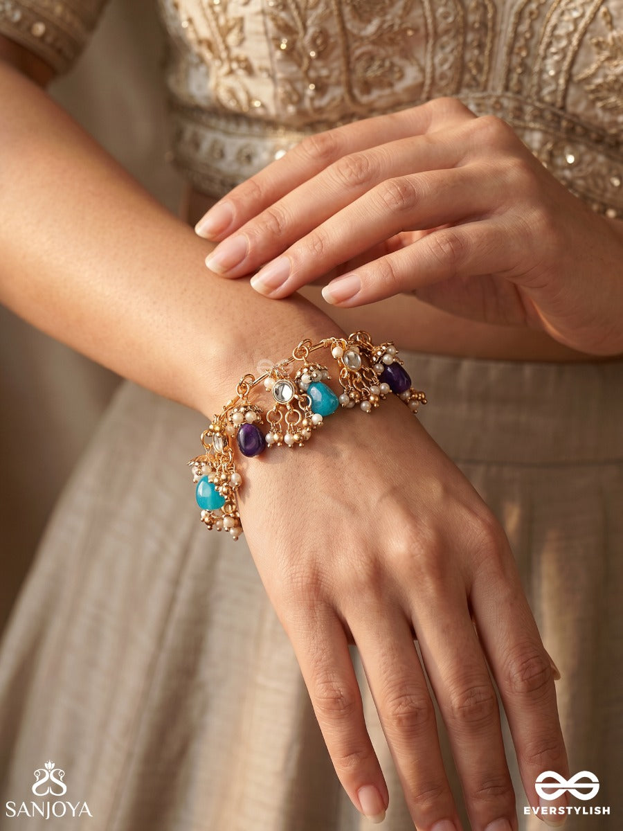 Sajraani – Adorned Royalty – Festive Single Piece Bracelet With Gold-Tone Charm Clusters, Mirror Details, Aqua Drops And Purple Bead Hangings
